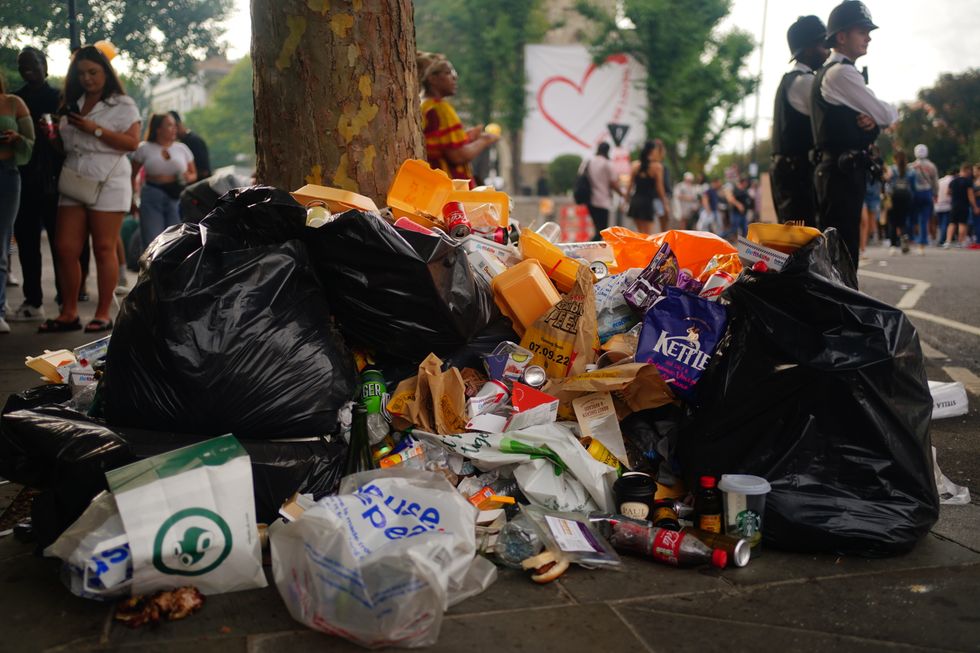 Rubbish mounts up as carnival-goers leave litter during the family day at the Notting Hill Carnival in London, which returned to the streets for the first time two years after it was thwarted by the pandemic. Picture date: Sunday August 28, 2022.