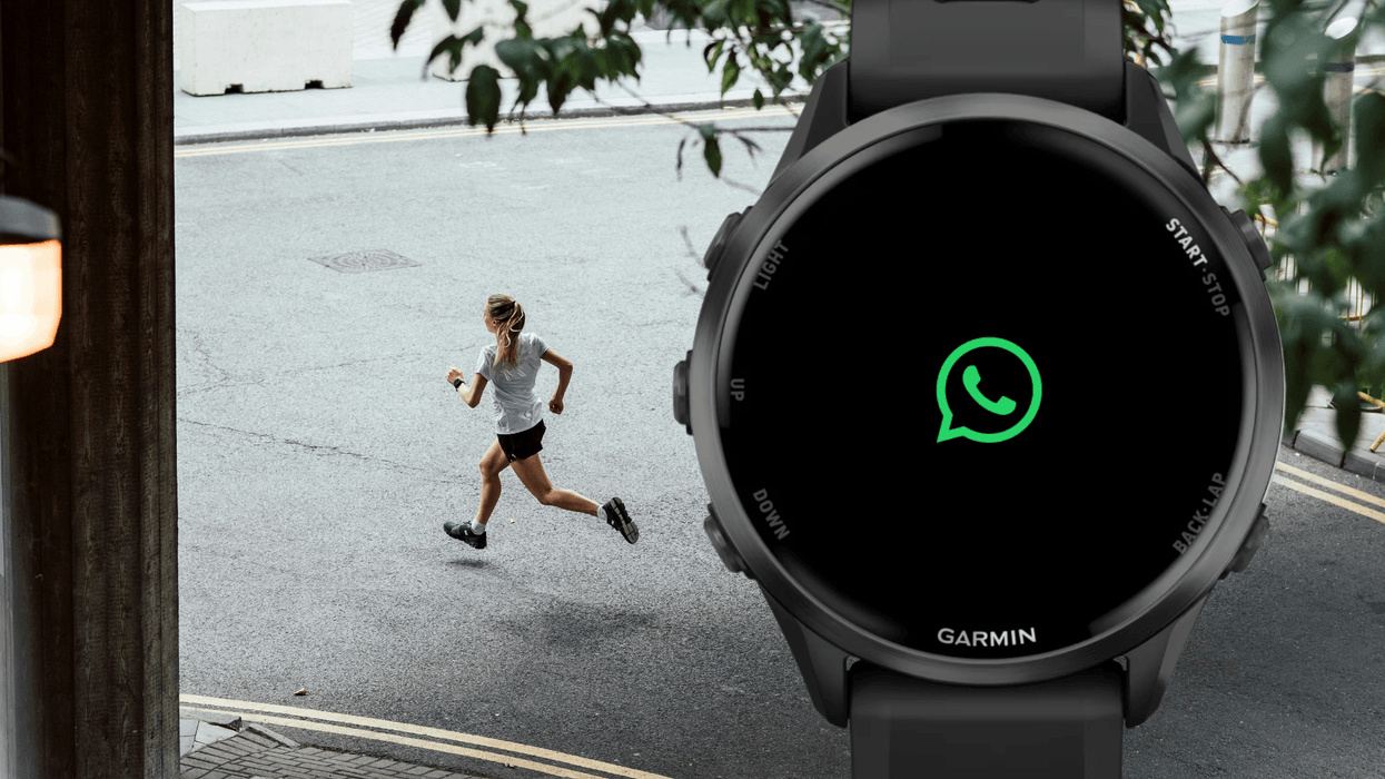 Runner next to Garmin watch displaying WhatsApp logo