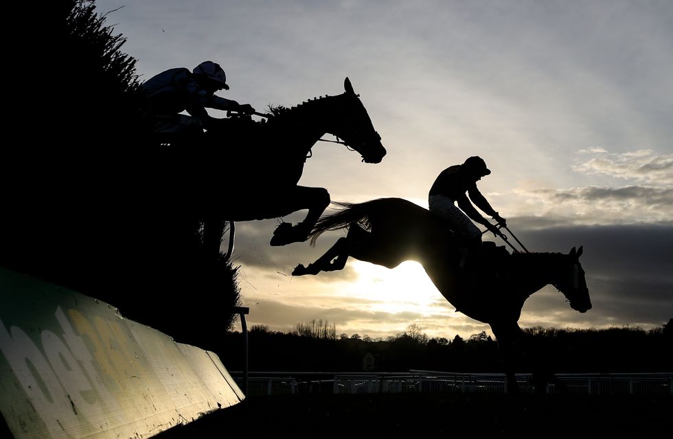 Runners and riders clear a fence during the Uttoxeter Tile And Bathroom Novices Handicap Chase at Uttoxeter Racecourse, Staffordshire. Picture date: Friday December 31, 2021.