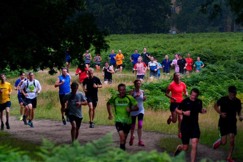 Runners taking part in the Parkrun at Bushy Park