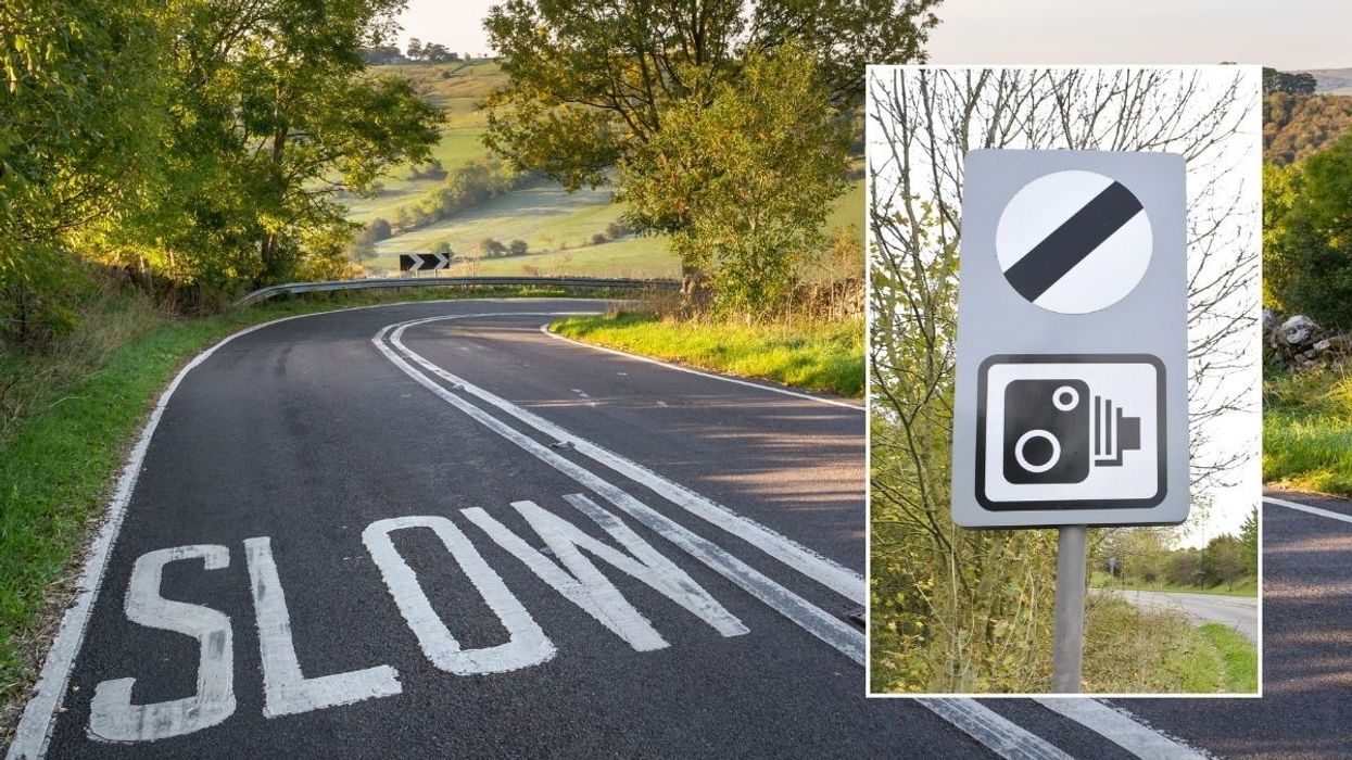 Rural road and a national speed limit sign