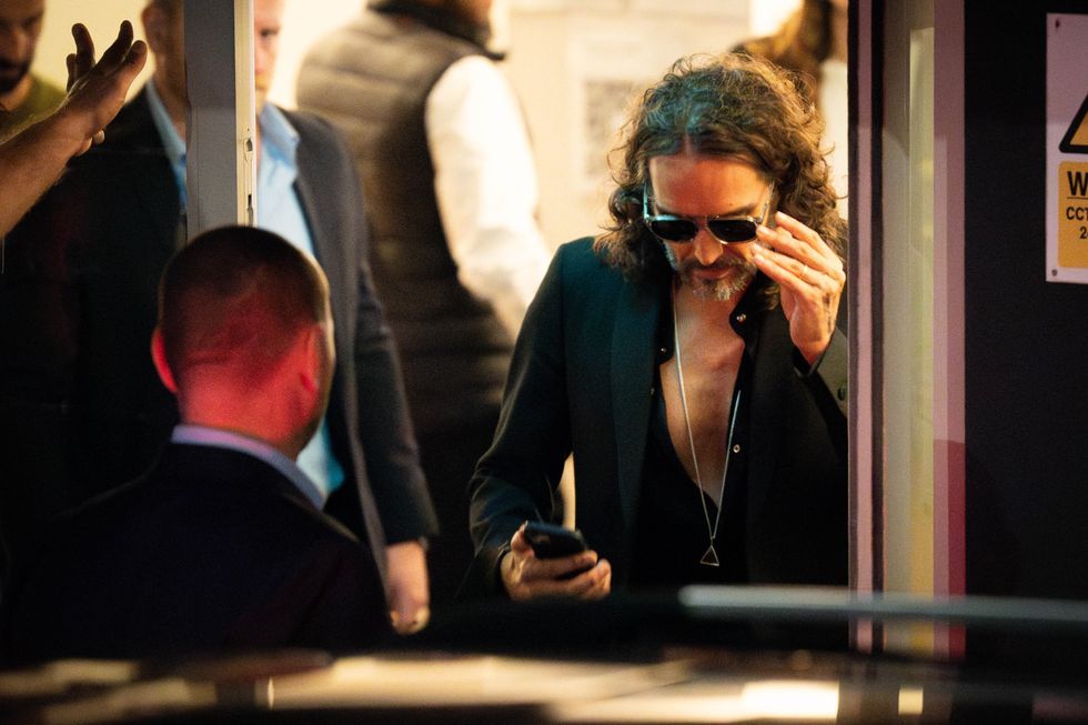 Russell Brand leaves Troubabour Wembley Park theatre in north-west London
