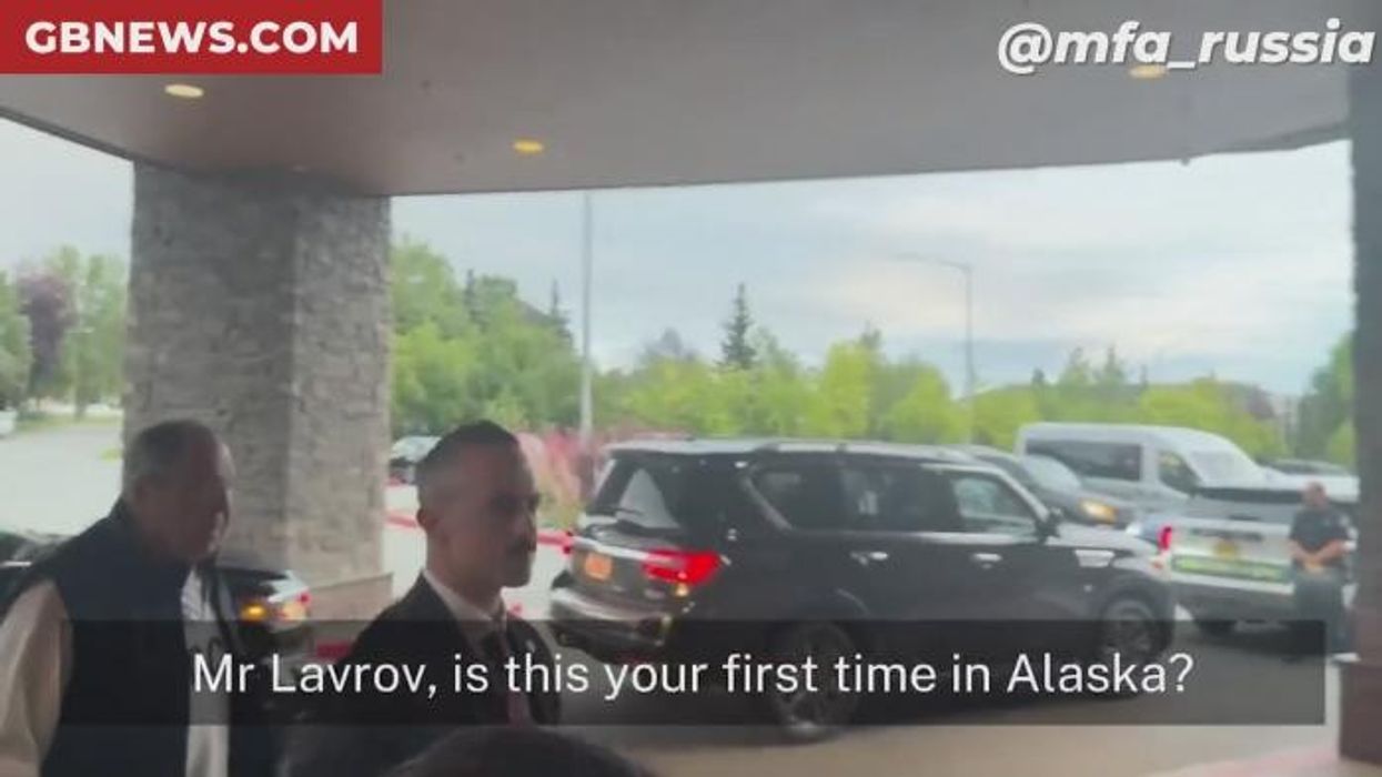 WATCH: Russia's foreign minister causes huge stir ahead of Ukraine summit as he turns up in provocative T-shirt