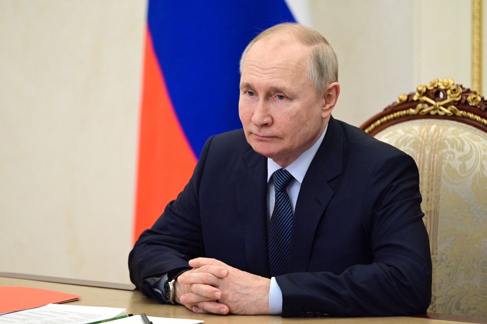Russia's President Vladimir Putin chairs a meeting with members of the Security Council