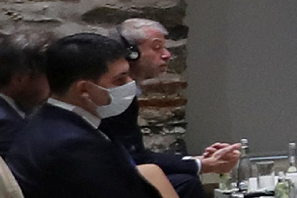 Russian billionaire Roman Abramovich listens as Turkish President Tayyip Erdogan (not seen) addresses Russian and Ukrainian negotiators before their face-to-face talks in Istanbul, Turkey March 29, 2022. Murat Cetinmuhurdar/Presidential Press Office/Handout via REUTERS.