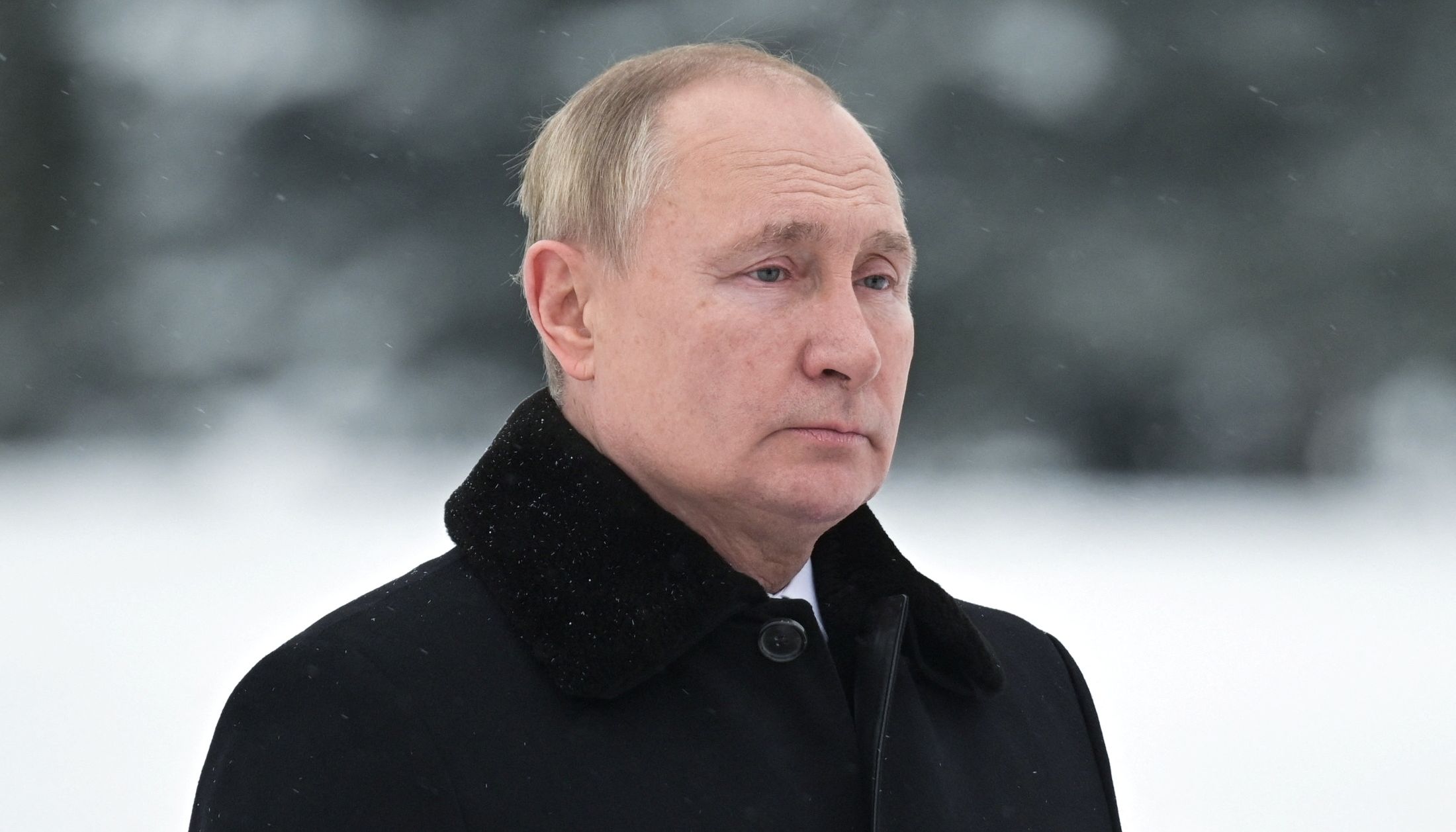 Russian President Vladimir Putin attends a flower-laying ceremony marking the 78th anniversary of lifting of the Leningrad siege during World War Two.
