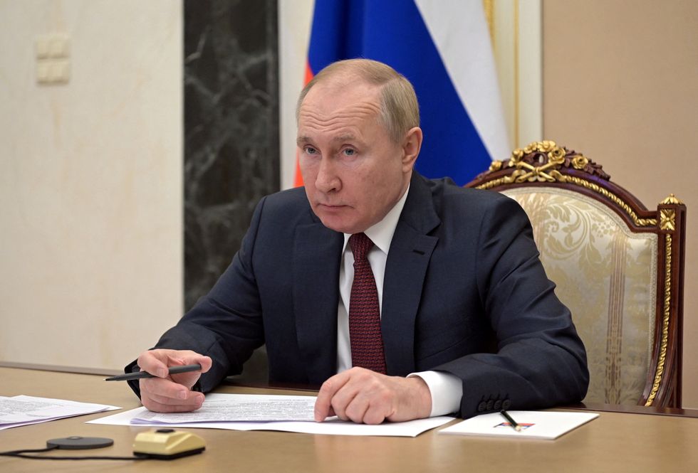 Russian President Vladimir Putin attends a meeting with government members via a video link in Moscow, Russia