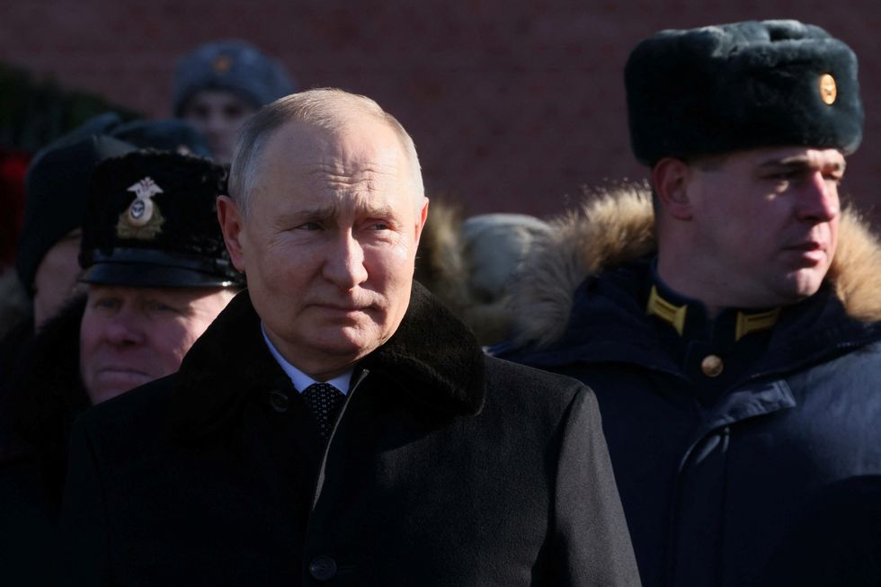 Russian President Vladimir Putin attends a wreath laying ceremony at the Tomb of the Unknown Soldier by the Kremlin Wall on the Defender of the Fatherland Day in Moscow, Russia, February 23, 2023. Sputnik/Mikhail Metzel/Pool via REUTERS ATTENTION EDITORS - THIS IMAGE WAS PROVIDED BY A THIRD PARTY.