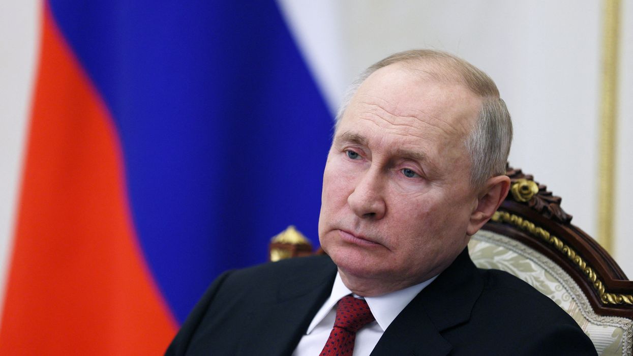 Russian President Vladimir Putin chairs a meeting with members of the government