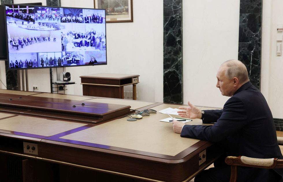 Russian President Vladimir Putin speaking in a meeting