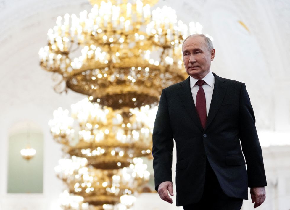 Russian President Vladimir Putin walks before an inauguration ceremony at the Kremlin in Moscow,