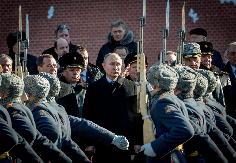 Russian President Vladimir Putin with members of the Russian military
