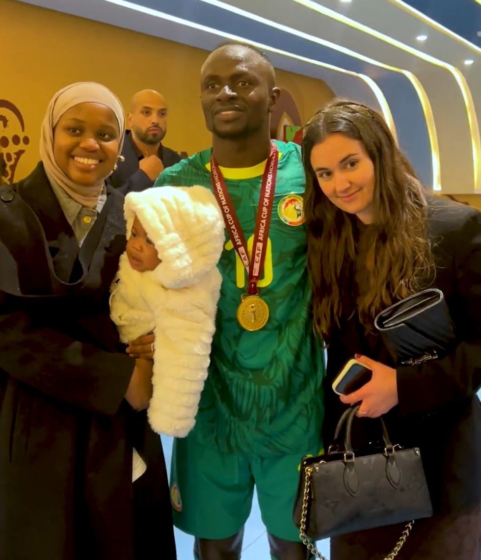 Sadio Mane celebrated his Afcon victory with his wife (left) and baby daughter