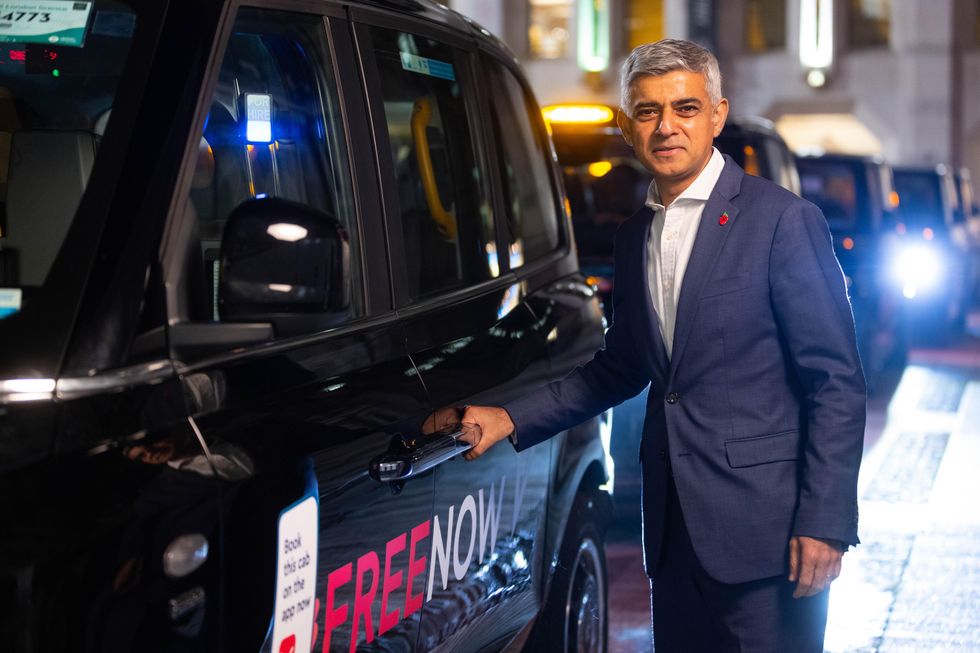 Sadiq Khan with an electric taxi in London