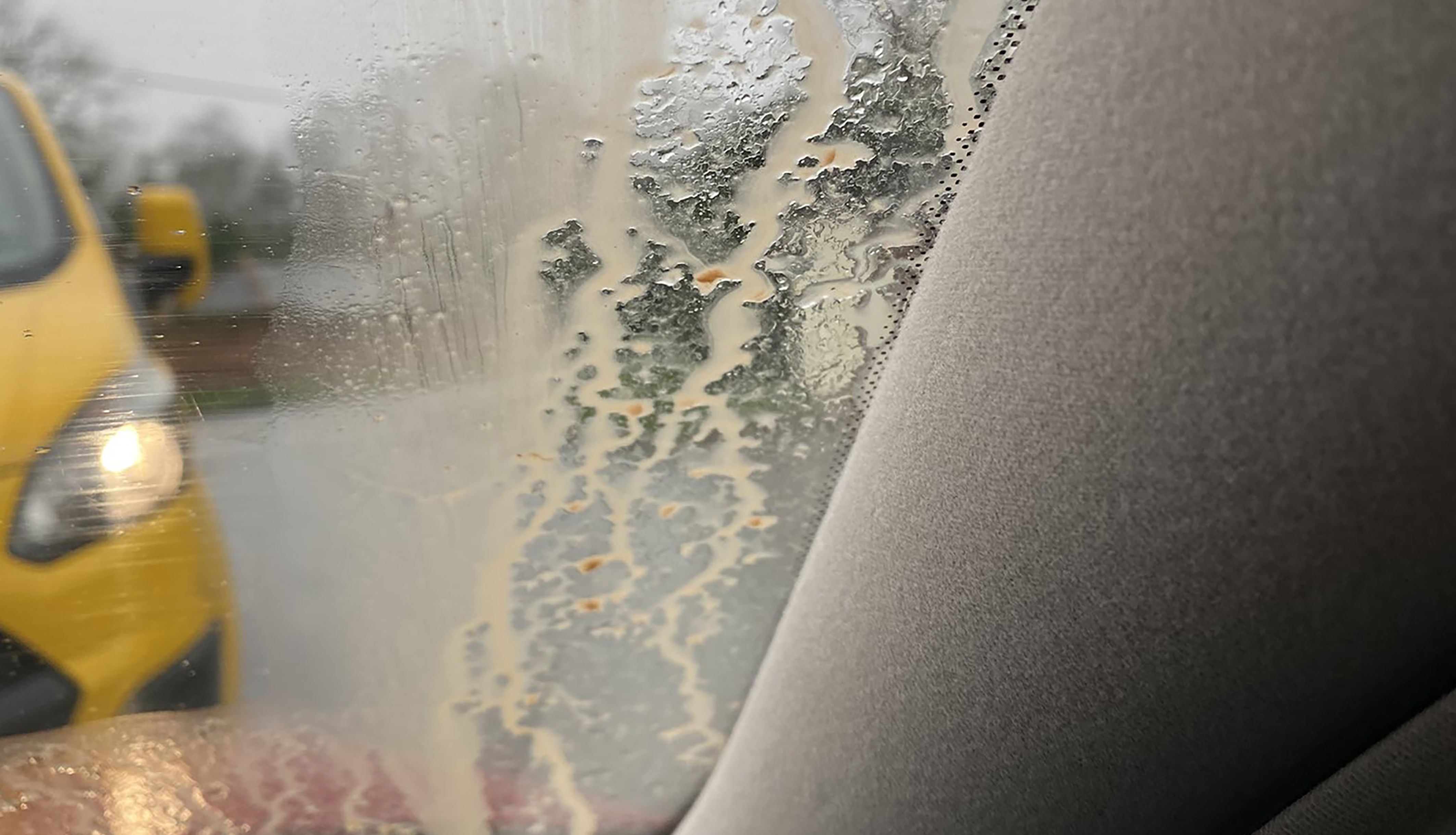 Saharan dust on a car windscreen, as the dust cloud which is moving across Europe hit the UK, turning the skies orange and red over southern parts of the country, forecasters have said. Issue date: Wednesday March 16, 2022.