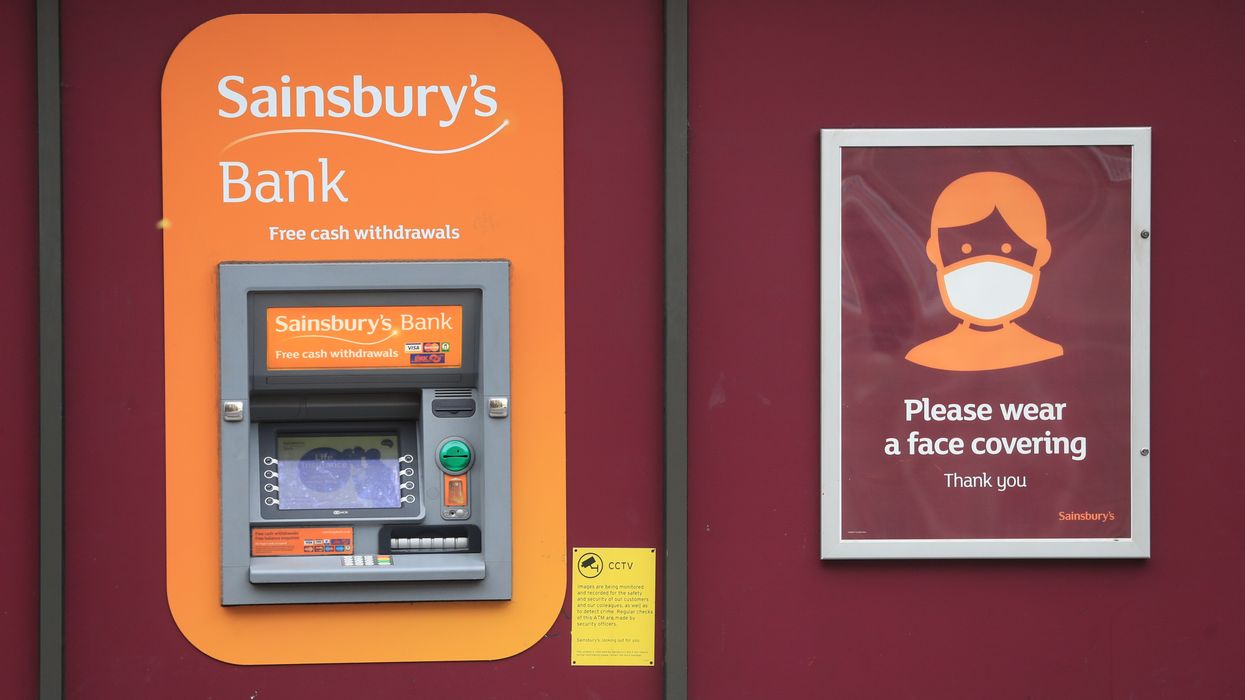 Sainsbury's Bank sign on ATM outside supermarket
