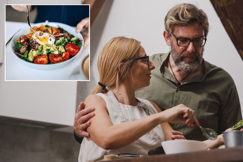 Salad with egg and avocado / Couple cooking dinner