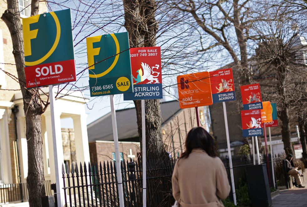 sale signs outside homes