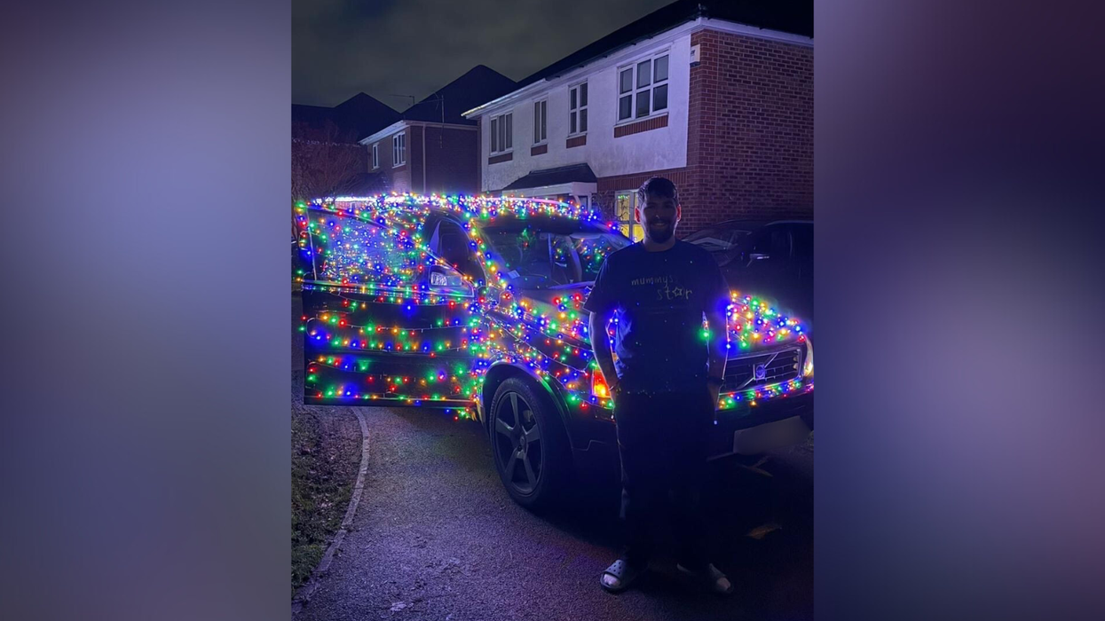 Sam Donnellan and car covered in Christmas lights