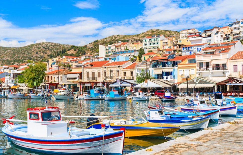 Samos, salil boats docked in water, restaurants and homes