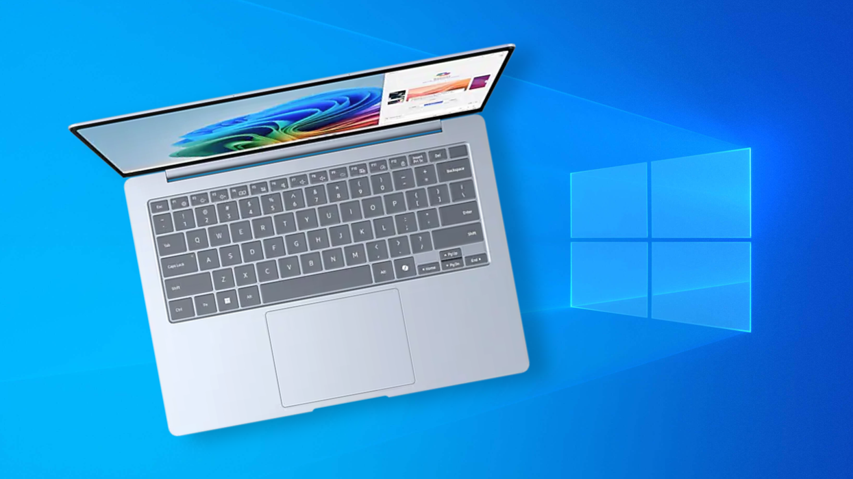Samsung copilot plus PC pictured on the side with the Windows 10 wallpaper in the background