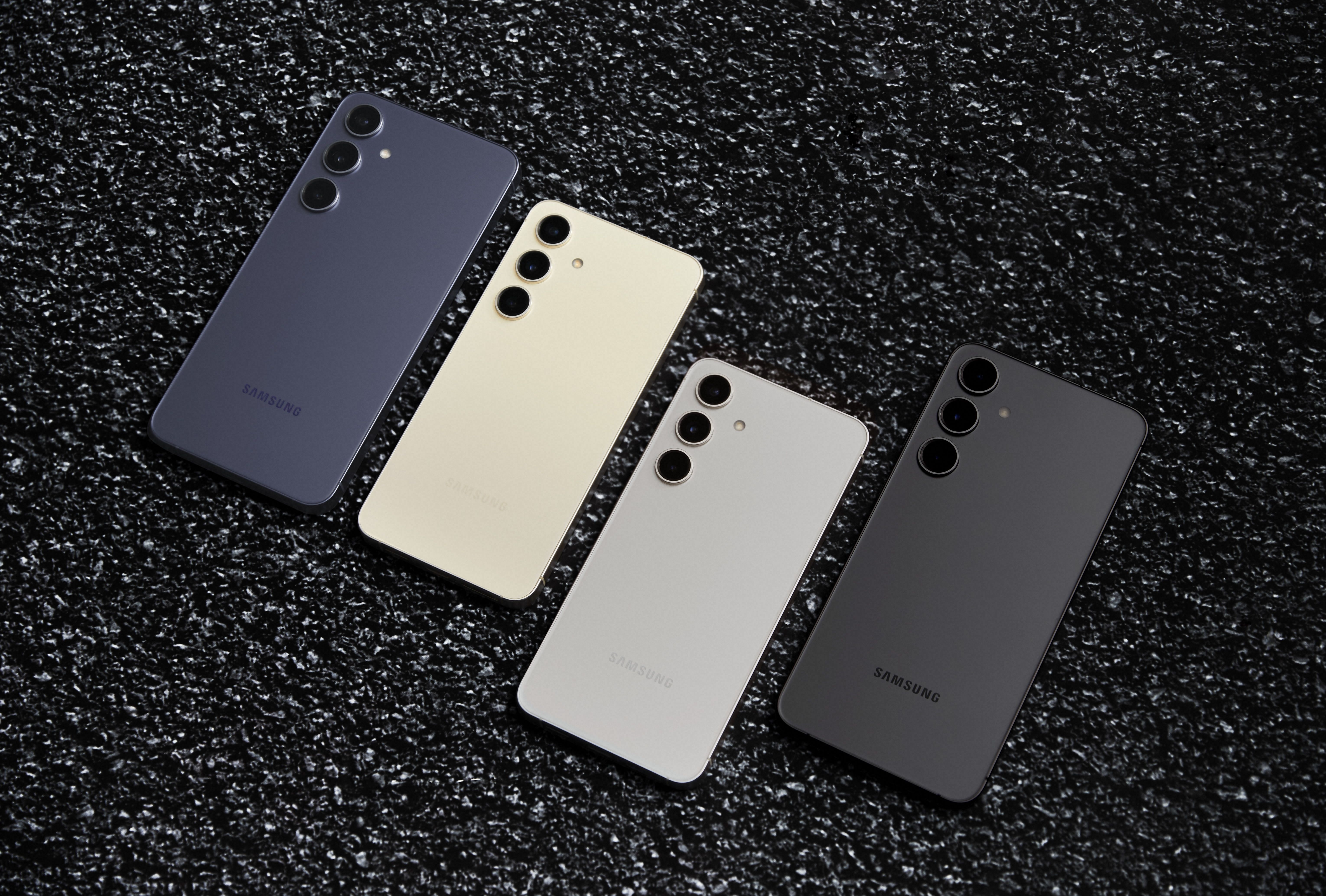 samsung galaxy s24, galaxy s24 plus, and galaxy s24 ultra lined-up and placed on a gravel background