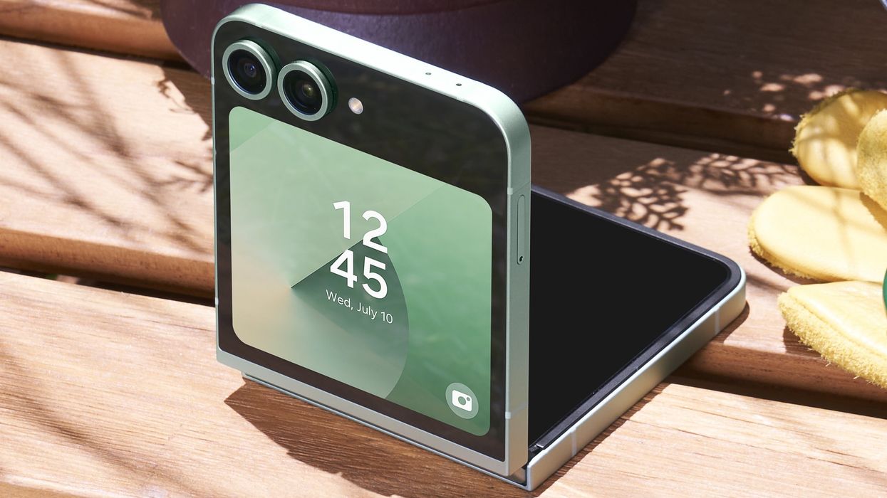 samsung galaxy z flip 6 in mint colour option pictured half-open on a wooden bench