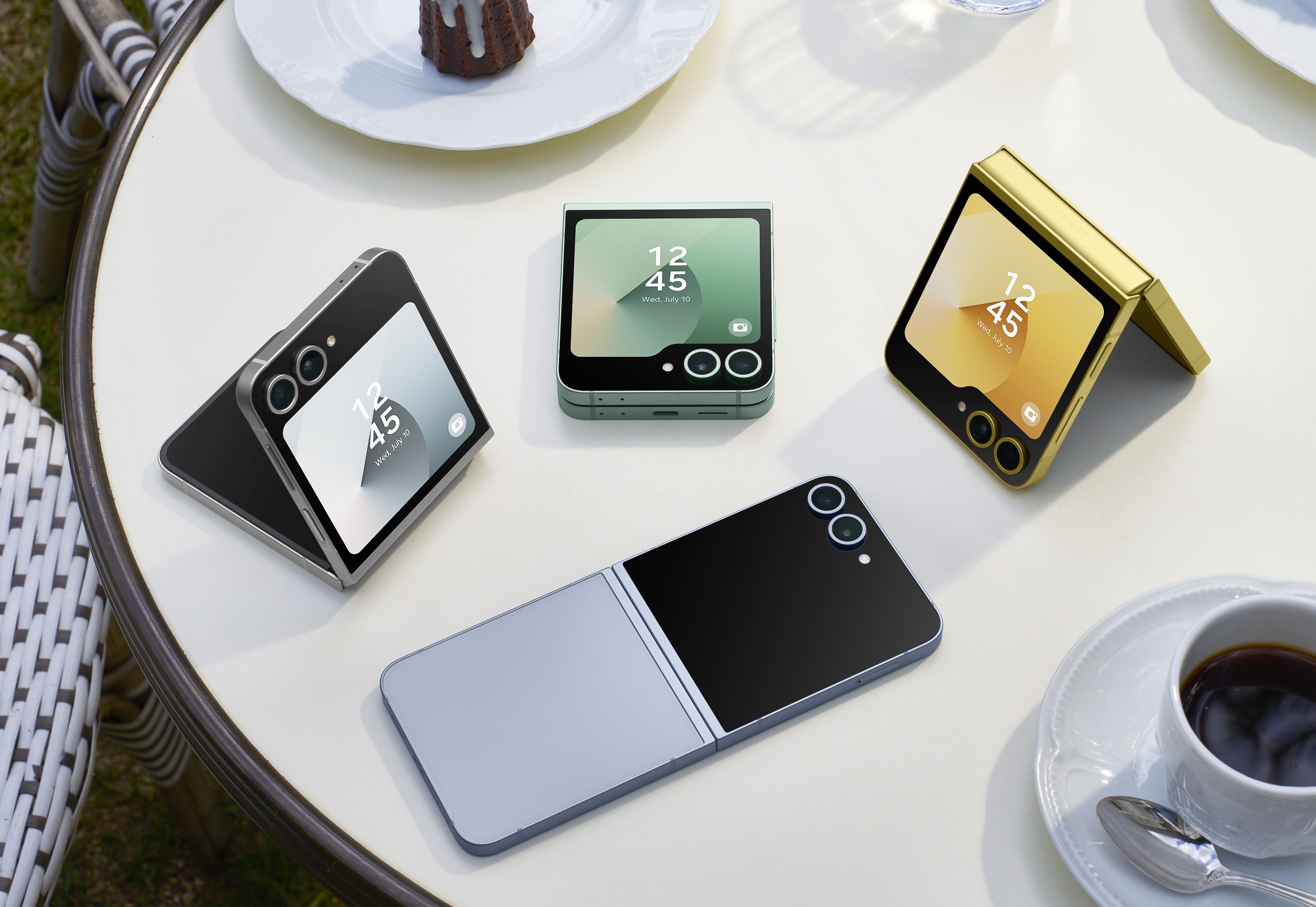 samsung galaxy z flip 6 pictured lying on a table in a variety of different colours, including mint, silver shadow, yellow, and blue