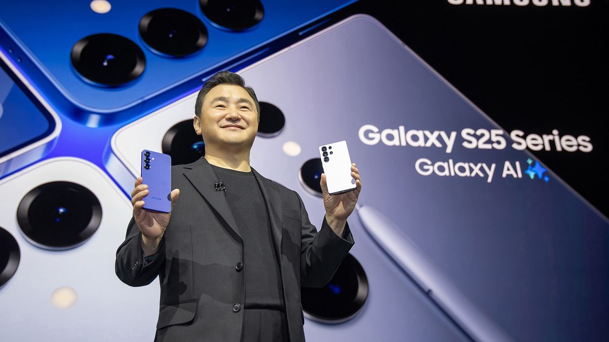 Samsung mobile chief Roh Tae-moon holding the Galaxy S25 and Galaxy S25 Ultra on-stage at launch