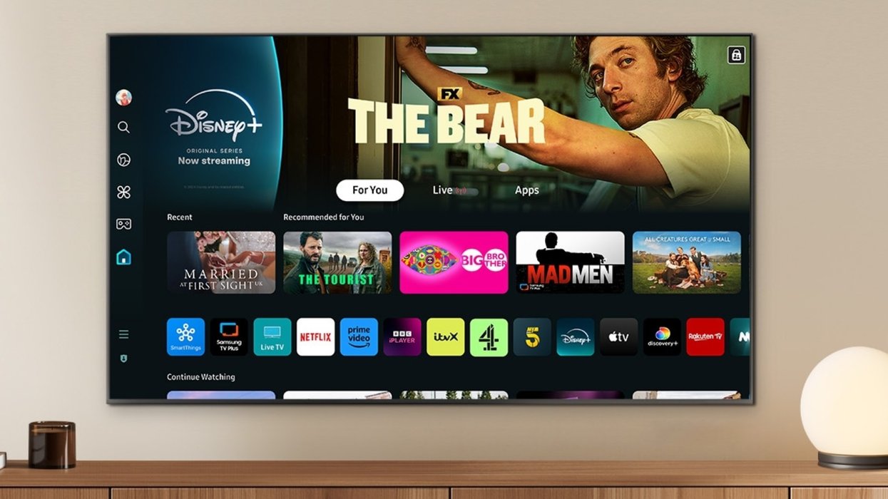 samsung neo QLED smart tv mounted on the wall with disney plus displayed on screen