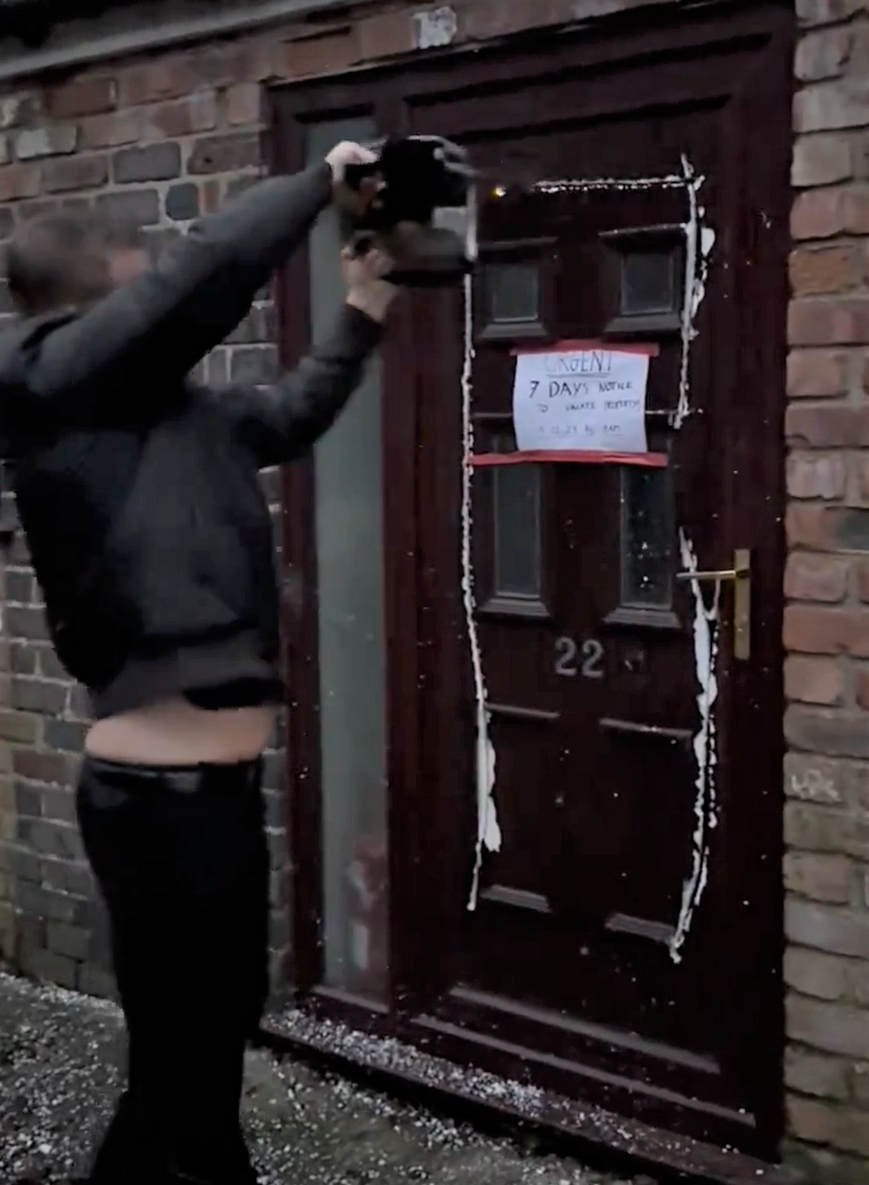 Samuel Leeds takes a chainsaw to the property's door
