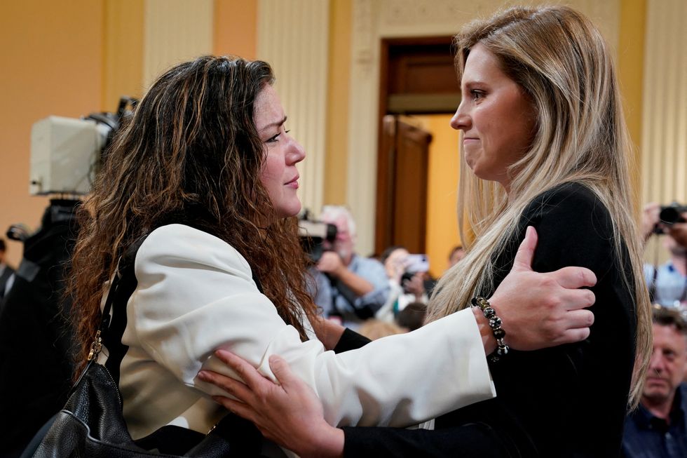 Sandra Garza, partner of deceased U.S. Capitol police officer Brian Sicknick, embraces U.S. Capitol Police officer Caroline Edwards after the hearing of the U.S. House Select Committee to Investigate the January 6 Attack on the United States Capitol was adjourned, on Capitol Hill in Washington, U.S., June 9, 2022. REUTERS/Elizabeth Frantz