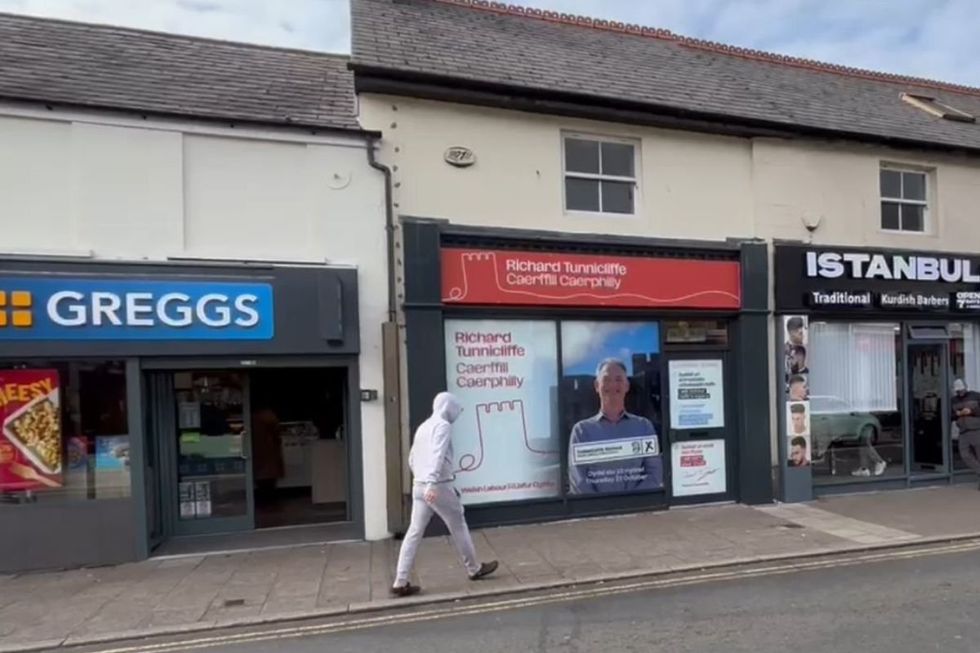 Sandwiched between a Greggs and a Turkish barbershop, Richard Tunnicliffe\u2019s office is covered in campaign ads