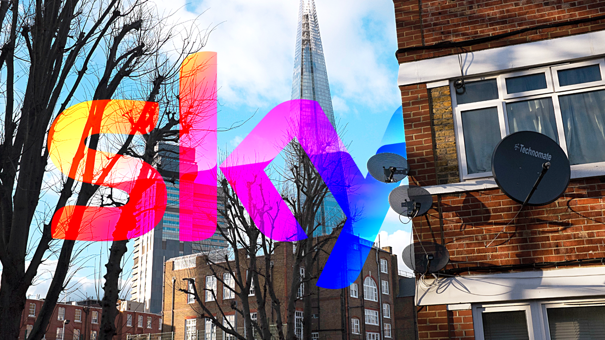 satellite dish mounted on the side of a building with the shard in the background and Sky TV logo