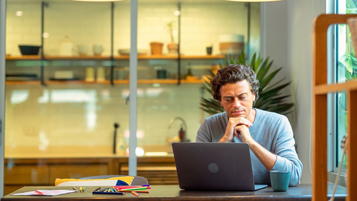 Saver looks at laptop in pictures