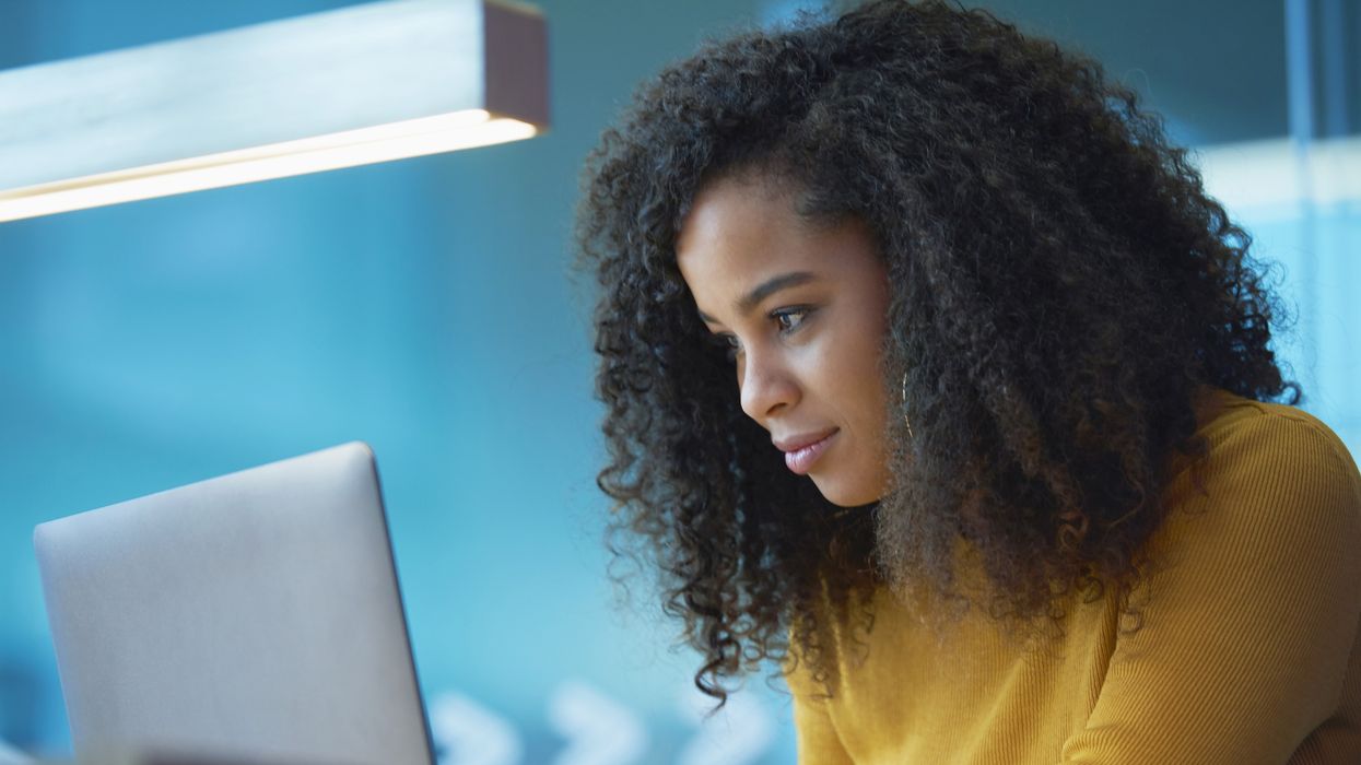 Saver looks at laptop