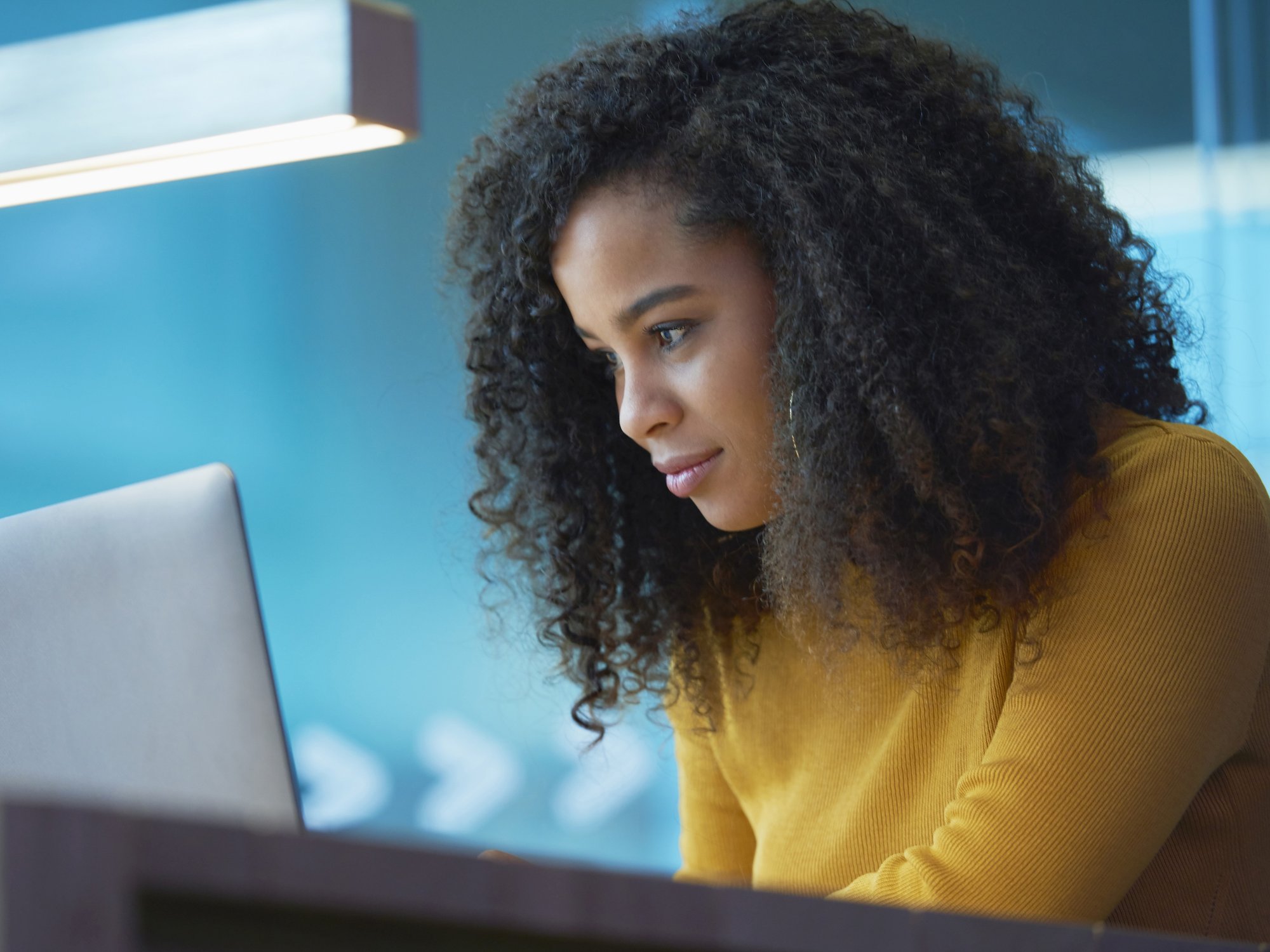 Saver looks at laptop