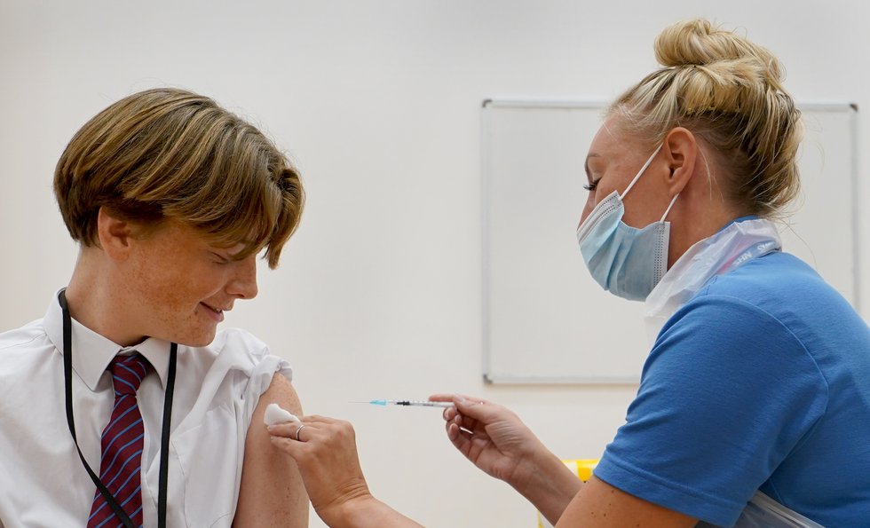 School pupil receives a Covid-19 vaccination