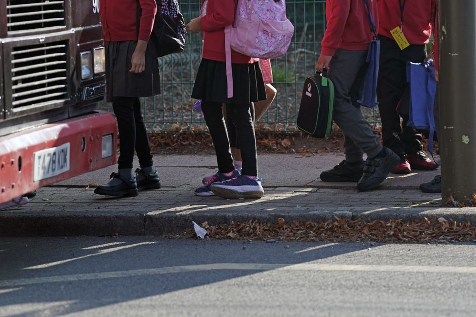 Schoolchildren boarding a bus