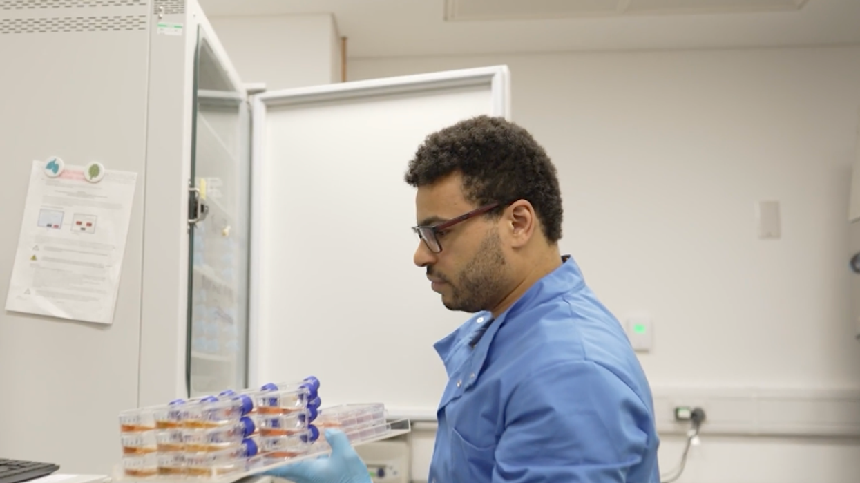 Scientists holding vials of anti-ageing drug