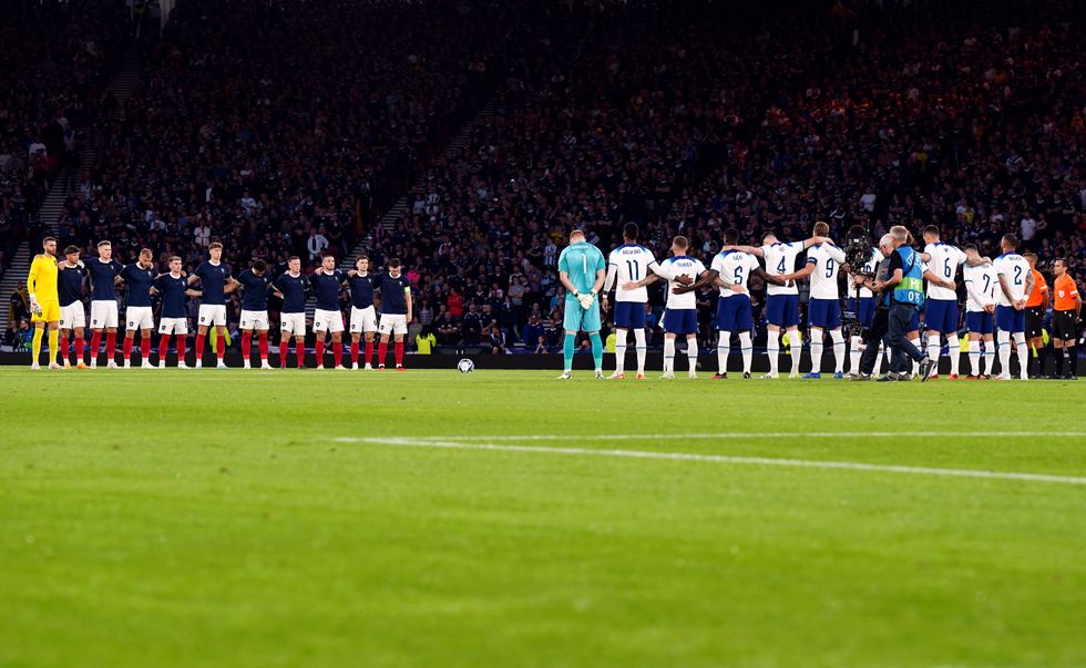 Scotland and England players observe a minutes silence during the 150th Anniversary Heritage international friendly match at Hampden Park, Glasgow