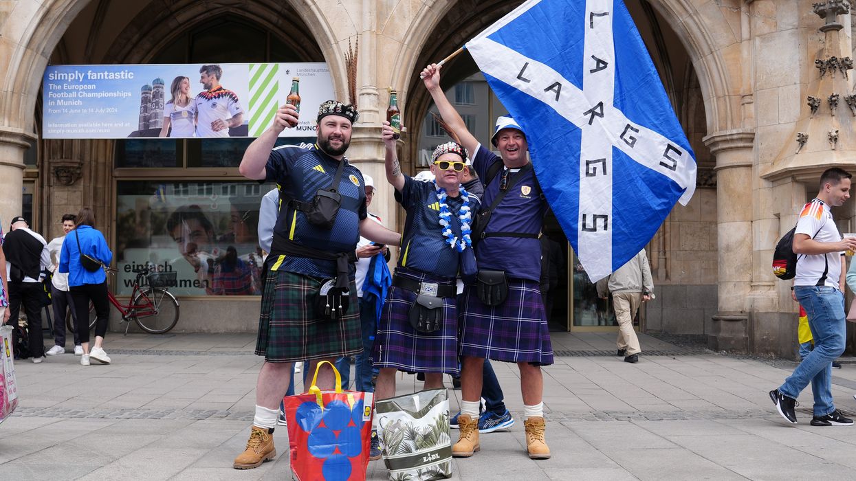Scotland fans pose for a photo at Marienplatz square, Munich