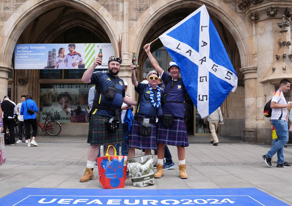 Scotland fans pose for a photo at Marienplatz square, Munich