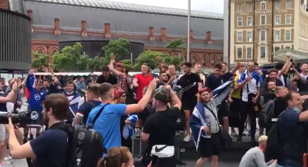 Scotland fans singing 'Yes sir I can boogie' outside King's Cross St Pancras station, as fans arrive from Scotland for the fixture against England at Wembley Stadium during the Euro 2020 tournament, from the Twitter feed of @SimonLamrock.
