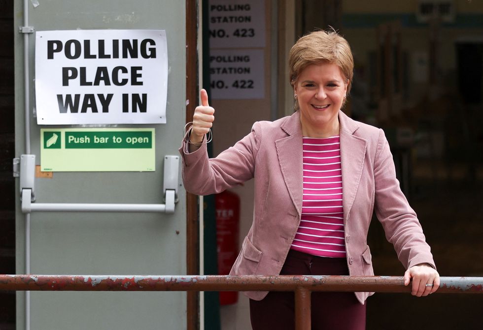 Scotland's First Minister and Scottish National Party (SNP) leader Nicola Sturgeon gestures outside a polling station during the local elections in Glasgow, Scotland.