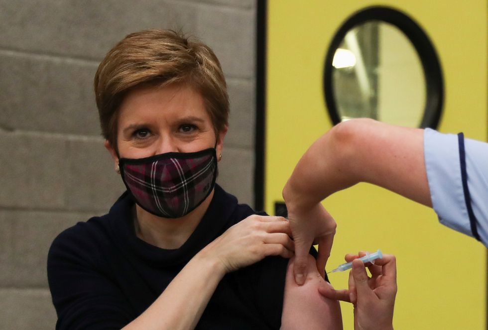 Scotland's First Minister Nicola Sturgeon receives a coronavirus disease (COVID-19) booster vaccination in Glasgow, Scotland, Britain, December 4, 2021. REUTERS/Russell Cheyne/Pool