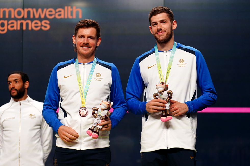Scotland's Greg Lobban and Rory Stewart with the bronze medals after the Men's Squash Double Bronze medal match at the University of Birmingham Hockey and Squash Centre on day eleven of the 2022 Commonwealth Games in Birmingham.