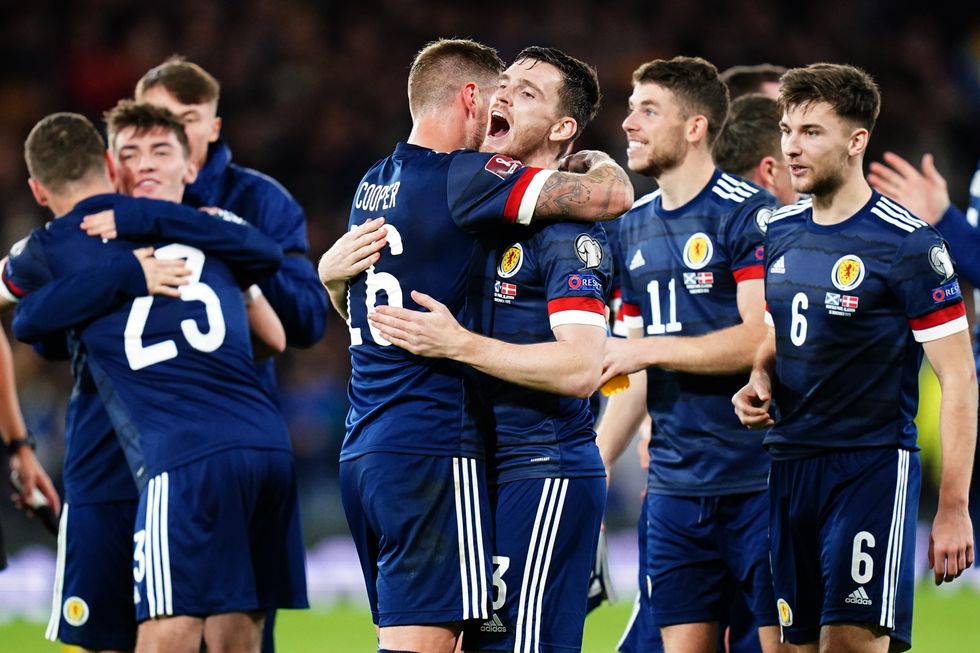 Scotland's Liam Cooper (left) and Scotland's Andrew Robertson celebrate after the FIFA World Cup Qualifying match at Hampden Park, Glasgow.