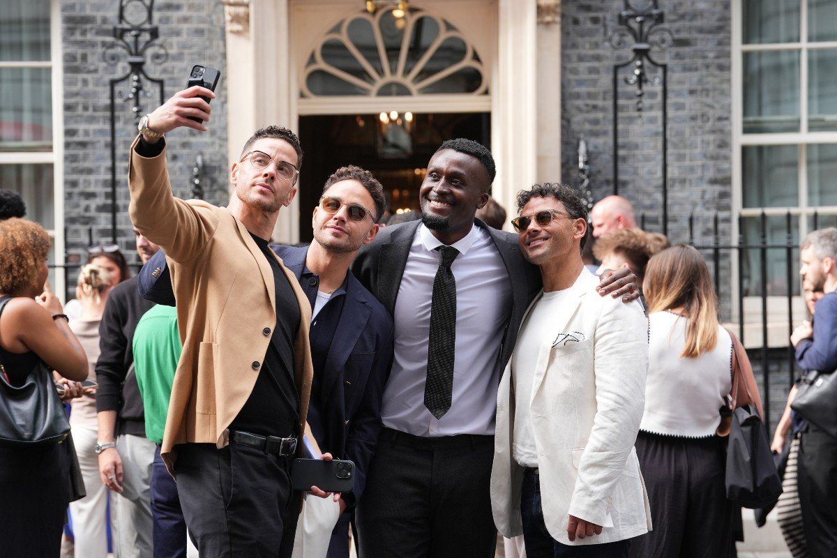 Scott Thomas (left), Adam Thomas (second left) and Ryan Thomas (right) pose for a selfie ahead of a reception hosted by Prime Minister Sir Keir Starmer for influencers at 10 Downing Street