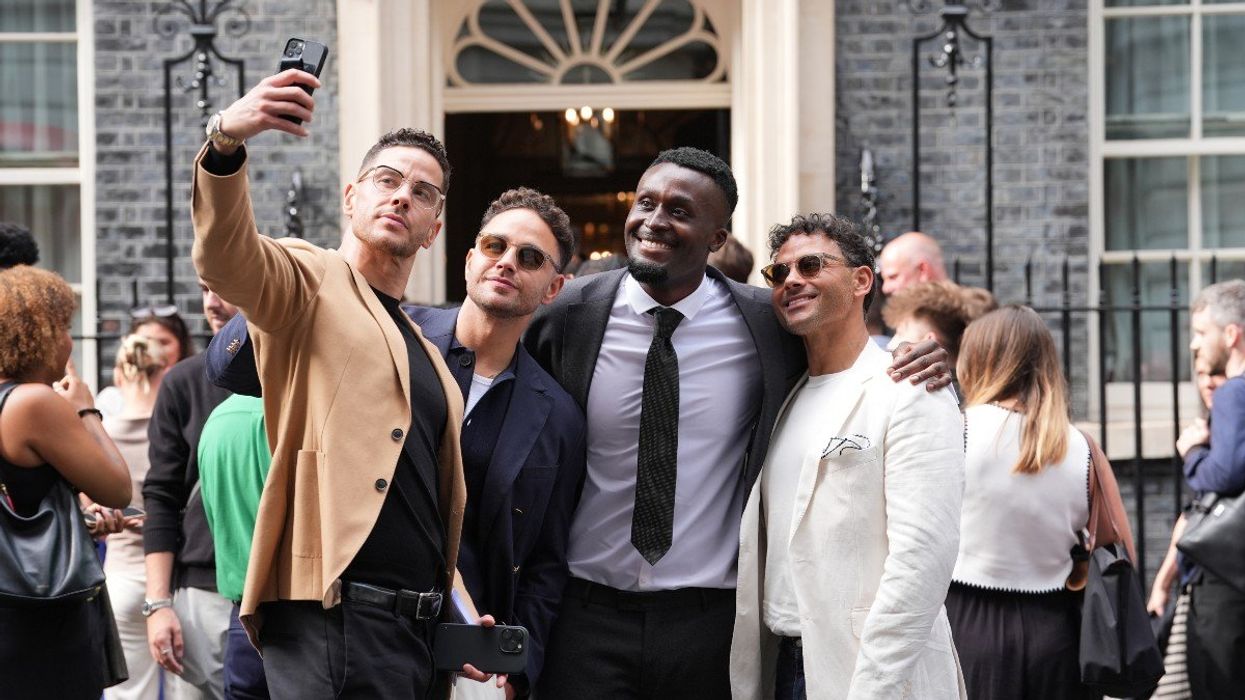 Scott Thomas (left), Adam Thomas (second left) and Ryan Thomas (right) pose for a selfie ahead of a reception hosted by Prime Minister Sir Keir Starmer for influencers at 10 Downing Street